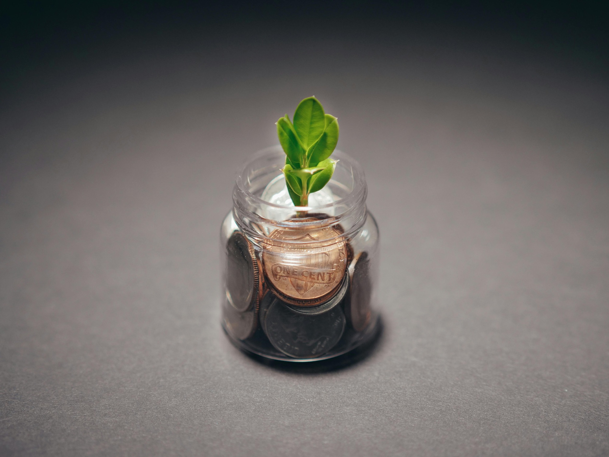 adding more money to an investment jar.