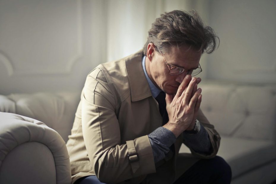 Person stressed because credit card bills are more than your salary